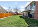 Large, grassy backyard featuring a wooden fence and an outdoor seating area at 12945 E Colorado Ave, Aurora, CO 80012