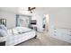 Bright bedroom with modern furnishings, ceiling fan, and a large window at 12945 E Colorado Ave, Aurora, CO 80012