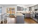 Modern kitchen featuring grey cabinets, stainless steel appliances, and access to the backyard at 12945 E Colorado Ave, Aurora, CO 80012