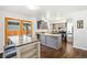 Stylish kitchen featuring grey cabinets, stainless steel appliances, and a breakfast bar at 12945 E Colorado Ave, Aurora, CO 80012