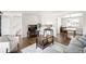 Cozy living room with hardwood floors, a white sofa, and an inviting atmosphere at 12945 E Colorado Ave, Aurora, CO 80012