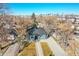 House with city skyline view, front yard, and driveway at 1361 W Custer Pl, Denver, CO 80223