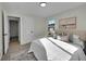 Spacious bedroom with a queen bed and access to another room at 1361 W Custer Pl, Denver, CO 80223