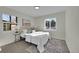 Well-lit bedroom with a queen-size bed and neutral color palette at 1361 W Custer Pl, Denver, CO 80223