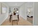 Bright dining room features a wood table, chairs, and view to backyard at 1361 W Custer Pl, Denver, CO 80223