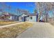 Newly remodeled bungalow featuring a fresh coat of paint and updated landscaping at 1361 W Custer Pl, Denver, CO 80223