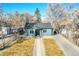 Updated bungalow with new paint, landscaping, and driveway at 1361 W Custer Pl, Denver, CO 80223