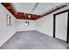 Bright and clean garage with overhead door and window at 1361 W Custer Pl, Denver, CO 80223
