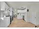 Modern kitchen with white shaker cabinets, quartz countertops, and stainless steel appliances at 1361 W Custer Pl, Denver, CO 80223