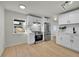 Contemporary kitchen featuring stainless steel appliances and white cabinetry at 1361 W Custer Pl, Denver, CO 80223