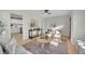 Open concept living room with views into the updated kitchen at 1361 W Custer Pl, Denver, CO 80223