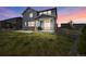 Inviting backyard with a covered patio, perfect for evening relaxation and enjoying the sunset at 6802 S Uriah St, Aurora, CO 80016