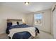 Cozy bedroom with a view outside the window and barn door closet at 6802 S Uriah St, Aurora, CO 80016