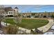 Beautiful common area at Southshore with well-maintained lawns and a decorative pergola at 6802 S Uriah St, Aurora, CO 80016