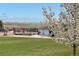 Community deck with chairs overlooking a scenic lake view offers a peaceful outdoor setting at 6802 S Uriah St, Aurora, CO 80016