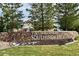 Stone sign reading The Lakehouse at Southshore with an attractive building visible in the background at 6802 S Uriah St, Aurora, CO 80016