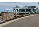 The Southshore community entrance boasts an attractive stone sign and a view of the clubhouse at 6802 S Uriah St, Aurora, CO 80016