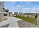 Landscaped front yard with a walkway and a partial view of the neighborhood at 6802 S Uriah St, Aurora, CO 80016
