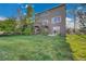 View of the backyard with a deck, stair access, and grassy lawn at 3790 Aspen Hollow Ct, Castle Rock, CO 80104