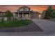 Charming two-story home boasting a covered front porch, well-manicured lawn, and an attached two-car garage at 3790 Aspen Hollow Ct, Castle Rock, CO 80104