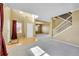 Spacious room with hardwood floors, carpet, a staircase, and large windows providing ample natural light at 3790 Aspen Hollow Ct, Castle Rock, CO 80104