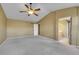 Spacious primary bedroom featuring vaulted ceilings, plush carpeting, and ensuite bath access at 3790 Aspen Hollow Ct, Castle Rock, CO 80104