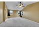 Spacious primary bedroom boasting vaulted ceilings, plush carpeting, and bright windows with scenic views at 3790 Aspen Hollow Ct, Castle Rock, CO 80104