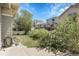 Well-maintained backyard, with green grass, small trees, and fencing at 3342 Springmeadow Cir, Castle Rock, CO 80109