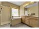 Luxurious bathroom featuring a glass-enclosed shower, soaking tub, and double vanity with tile flooring for a spa-like experience at 3342 Springmeadow Cir, Castle Rock, CO 80109