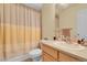 Cozy bathroom featuring a neutral vanity, shower with curtain and classic fixtures at 3342 Springmeadow Cir, Castle Rock, CO 80109