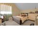 Comfortable bedroom with sloped ceiling, window, and furnishings at 3342 Springmeadow Cir, Castle Rock, CO 80109