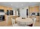 Spacious kitchen with island, built-in desk, and lots of natural light at 3342 Springmeadow Cir, Castle Rock, CO 80109