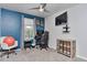 This is a well lit bedroom with large window, gaming system, and stylish furniture at 10042 Hudson St, Thornton, CO 80229