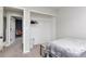 Bright bedroom with closet and view to room with chair and desk at 10042 Hudson St, Thornton, CO 80229