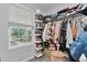 This is a walk-in closet with custom built-in shelving to maximize storage space and natural light at 10042 Hudson St, Thornton, CO 80229
