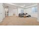 Finished basement with plush carpeting, a comfortable seating area, and easy access to other rooms at 4190 W Alameda Ave, Denver, CO 80219