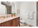 Bathroom with a modern vanity and mirror, toilet, and shower at 4190 W Alameda Ave, Denver, CO 80219