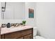 Clean bathroom featuring updated vanity with granite countertops at 4190 W Alameda Ave, Denver, CO 80219