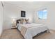 Cozy bedroom with neutral carpet, ample natural light, and comfortable furnishings at 4190 W Alameda Ave, Denver, CO 80219