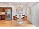 Bright dining area with table set with view of stainless refrigerator at 4190 W Alameda Ave, Denver, CO 80219