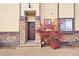 Inviting front entrance with stone accents, a decorative door, and well-maintained landscaping at 4190 W Alameda Ave, Denver, CO 80219