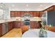 Well-equipped kitchen featuring stainless steel appliances and wooden cabinets at 4190 W Alameda Ave, Denver, CO 80219