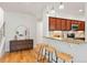 Modern kitchen with bar seating, stylish cabinets, and contemporary finishes at 4190 W Alameda Ave, Denver, CO 80219