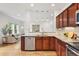 Modern kitchen featuring stainless steel dishwasher, and granite countertops at 4190 W Alameda Ave, Denver, CO 80219
