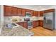 Granite countertops, stainless appliances, and undermount sink enhance this well-equipped kitchen at 4190 W Alameda Ave, Denver, CO 80219