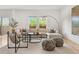 Spacious living room with stylish decor, a large sectional sofa, and natural light at 4190 W Alameda Ave, Denver, CO 80219
