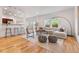 Open living room with modern furniture, a large window, and hardwood floors throughout at 4190 W Alameda Ave, Denver, CO 80219