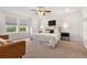 Serene primary bedroom featuring natural light from the large windows at 4190 W Alameda Ave, Denver, CO 80219