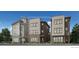 Modern three-story home featuring a mix of stone, horizontal, and vertical siding at 10898 E Hinsdale Cir, Centennial, CO 80112