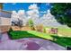 The backyard offers a patio, green grass, mature landscaping, and a view of mountains at 10057 Cedaridge Way, Highlands Ranch, CO 80129